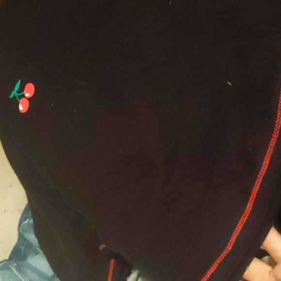 A black n red t-shirt that has a cherry on it - Picture 2 of 2